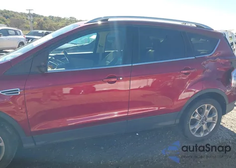2014 Ford Escape Titanium z USA, uszkodzony, nr VIN 1FMCU0J99EUD79087